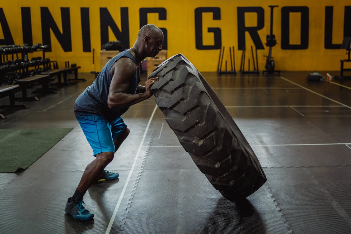 Adult performing a supported squat exercise for bone strength with proper form