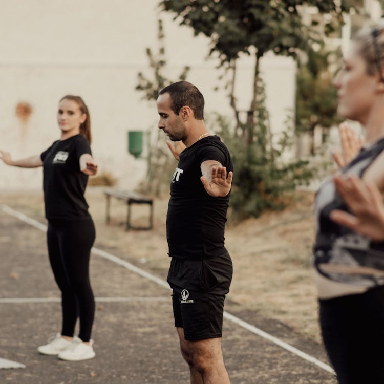 Group of adults walking together along a coastal path in North Tyneside